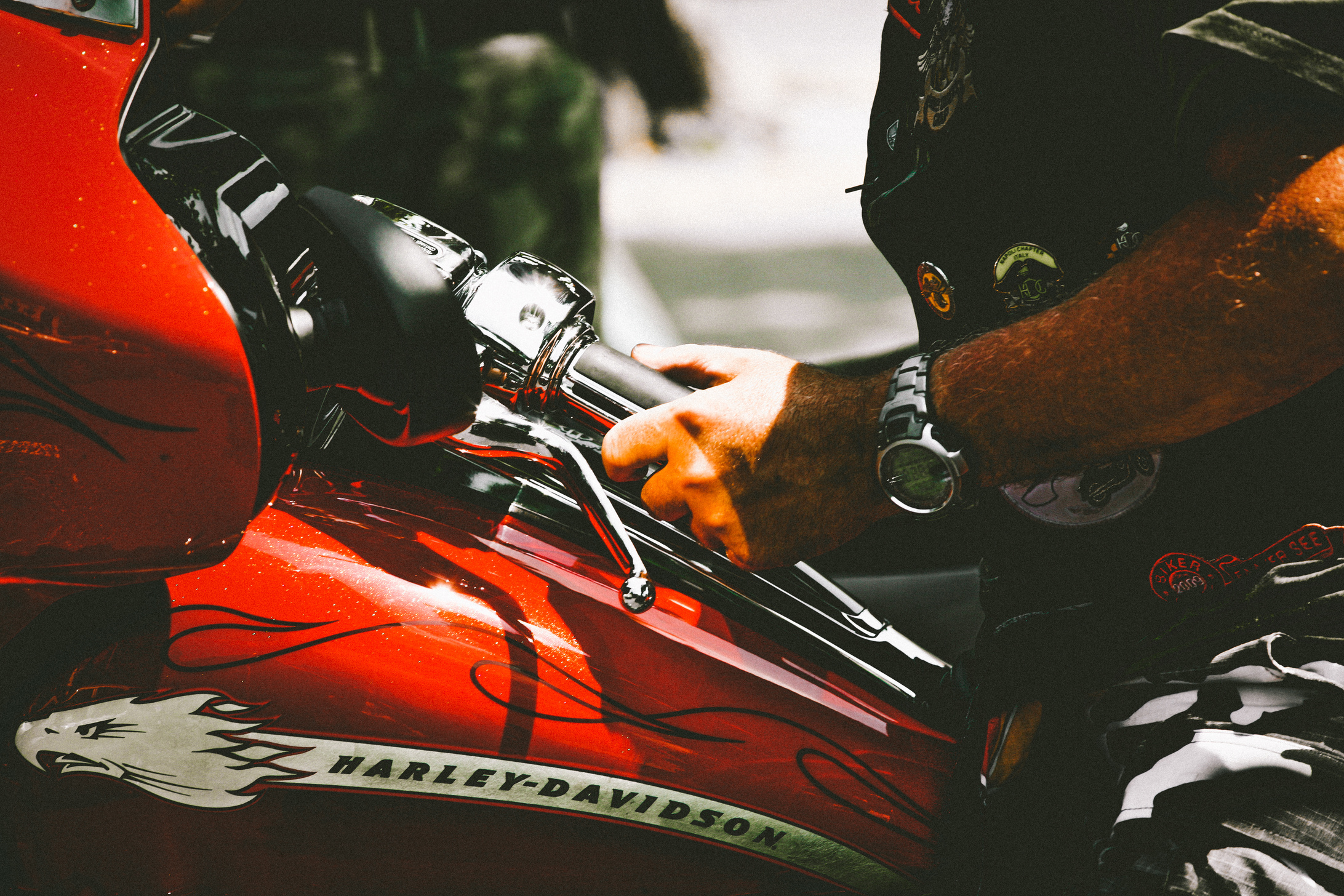 Close-Up Photo of Person Riding Harley Davidson Motorcycle